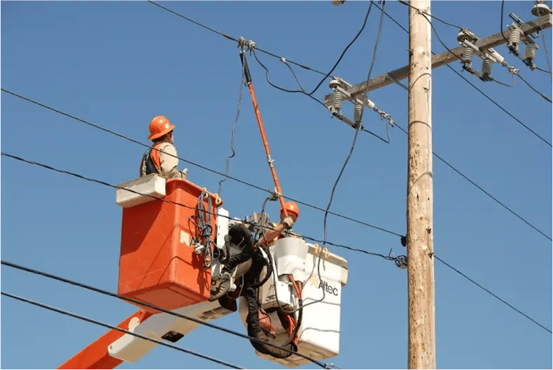 Powerline engineer working on lines.